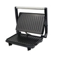 Black and silver nonstick electric grill and steak maker with ribbed grilling plates for even cooking and searing