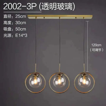 Gold-toned nordic modern minimalist glass pendant light with three transparent spheres suspended from brass bar pendant lamp