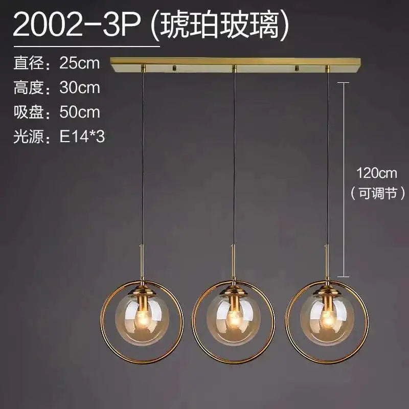 Nordic modern minimalist glass pendant light with brass finish three-light fixture and clear glass globe shades