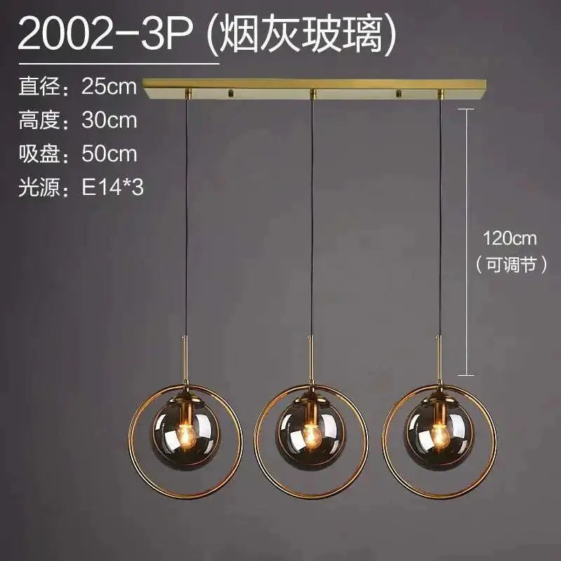 Modern nordic minimalist glass pendant light with three smoked glass globes and gold-toned metal rings suspension