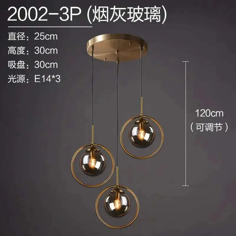 Modern three-light nordic modern minimalist glass pendant light with smoked glass globes and gold-toned metal rings