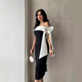 Black and white off-shoulder color matching elegant cocktail dress with large satin bow on shoulder for formal occasions