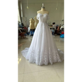 White off-shoulder lace bridal wedding dress with sweetheart neckline and intricate lace detailing on bodice and skirt