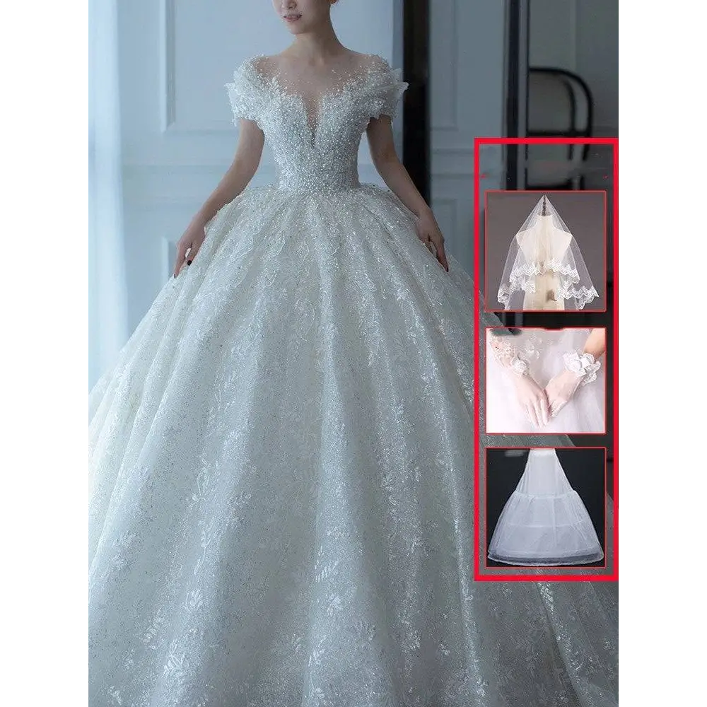 White lace wedding veil with scalloped edge and sheer overlay complements off shoulder lace wedding dress piece set
