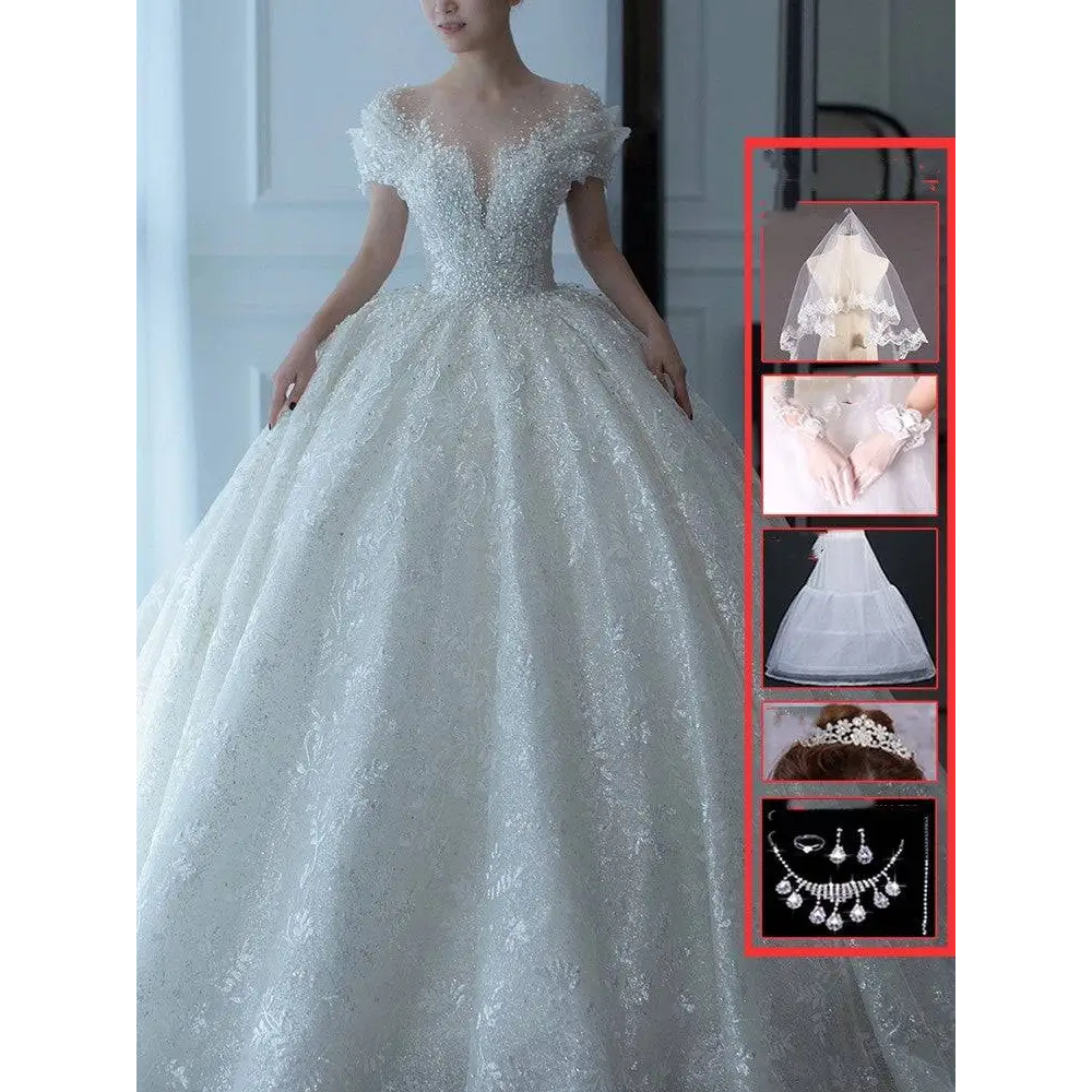 White lace wedding dress with off shoulder lace wedding sleeves and a voluminous skirt dress piece set