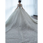 Off shoulder lace wedding dress in white featuring lace material and a voluminous skirt perfect for bridal wear