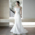 Off-shoulder satin light wedding dress with a flowing white fabric, fitted bodice, and sweeping train