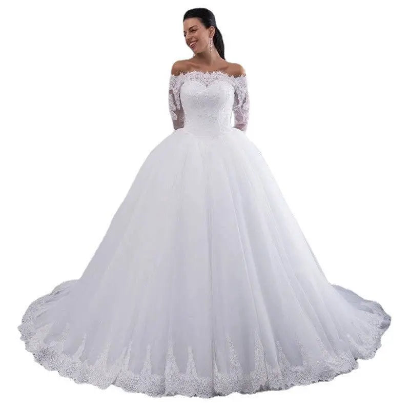 White off-the-shoulder bridal wedding lace gown with intricate lace detailing and voluminous tulle skirt