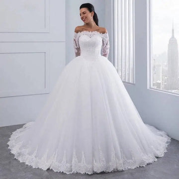 White off-the-shoulder bridal wedding lace gown with long sleeves and voluminous tulle skirt for elegant weddings