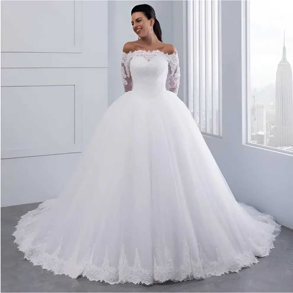 A white off-the-shoulder bridal wedding lace gown with long sleeves and a voluminous tulle skirt perfect for weddings