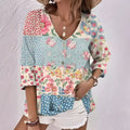 Oil painting printed floral v-neck blouse in pastel pink blue and cream polyester fiber with button front and three quarter sleeves