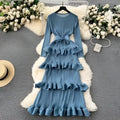 A long-sleeved blue pleated long dress with ruffled layers and matching belt for heavy industry pleated style