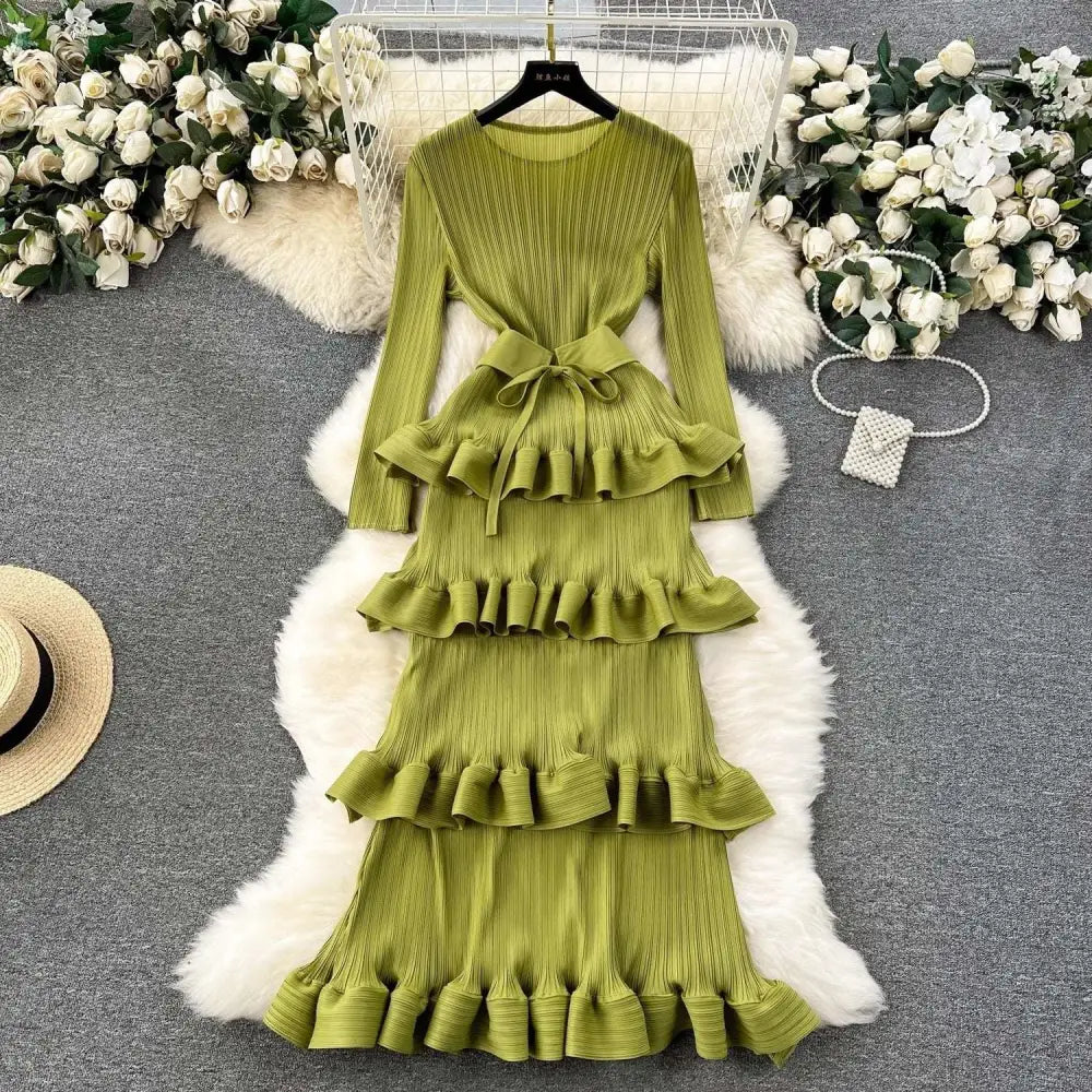 Olive green cake heavy industry pleated long dress with tiered ruffles, long sleeves, and matching belt