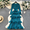 Teal heavy industry pleated long dress with ruffled layers and matching belt from olive green cake collection