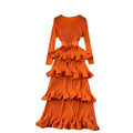 A vibrant orange heavy industry pleated long dress with ruffled layers and tiered pleated fabric, inspired by olive green cake