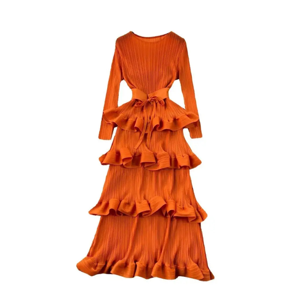 A vibrant orange heavy industry pleated long dress with ruffled layers and tiered pleated fabric, inspired by olive green cake
