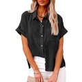 Black short-sleeved button-up shirt with subtle textured weave and rolled cuffs made from casual cotton linen fabric