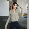 Olive green cropped running sport coat with long sleeves and sleek zip-up design from Royale Essence Lux