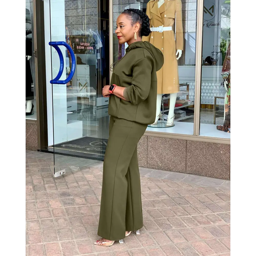 Olive green solid loose hooded sweatsuit with flared pants designed for comfortable casual wear