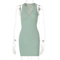 A sleek olive green stripe knitted women sleeveless dress with a deep v-neckline and sheer mesh back panel