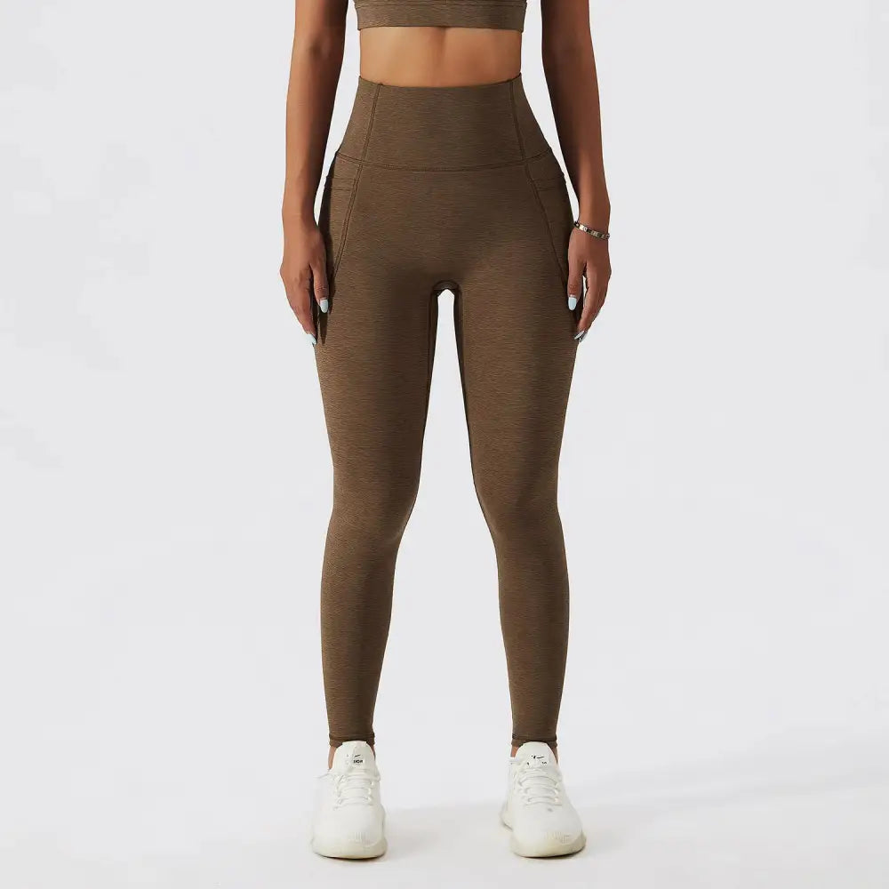 High-waisted olive green yoga leggings with textured fabric and side pockets in bra fitness suit for sports underwear gathers