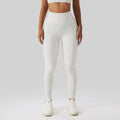 White high-waisted leggings with textured form-fitting design paired with olive green yoga bra fitness suit with pockets