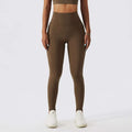 High-waisted olive green yoga leggings with textured stretchy fabric and side pockets for bra fitness suit sets