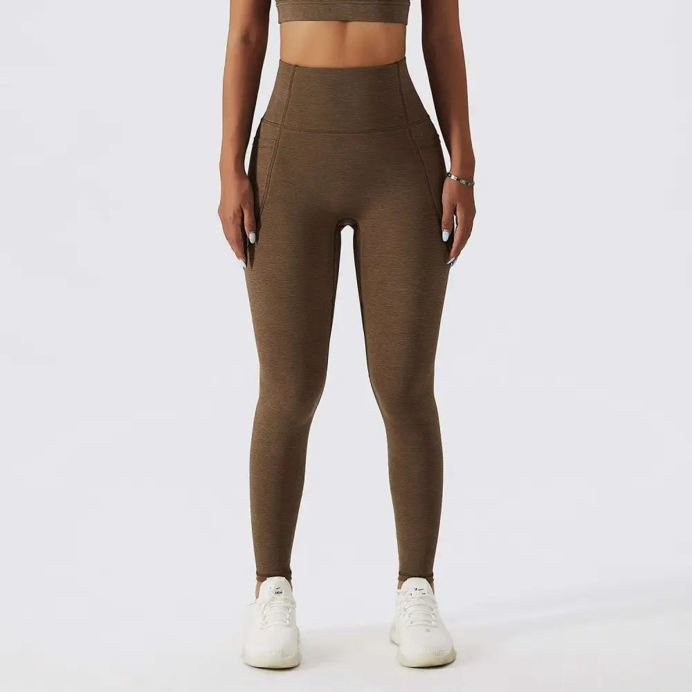 High-waisted olive green yoga leggings with textured stretchy fabric and side pockets for bra fitness suit sets