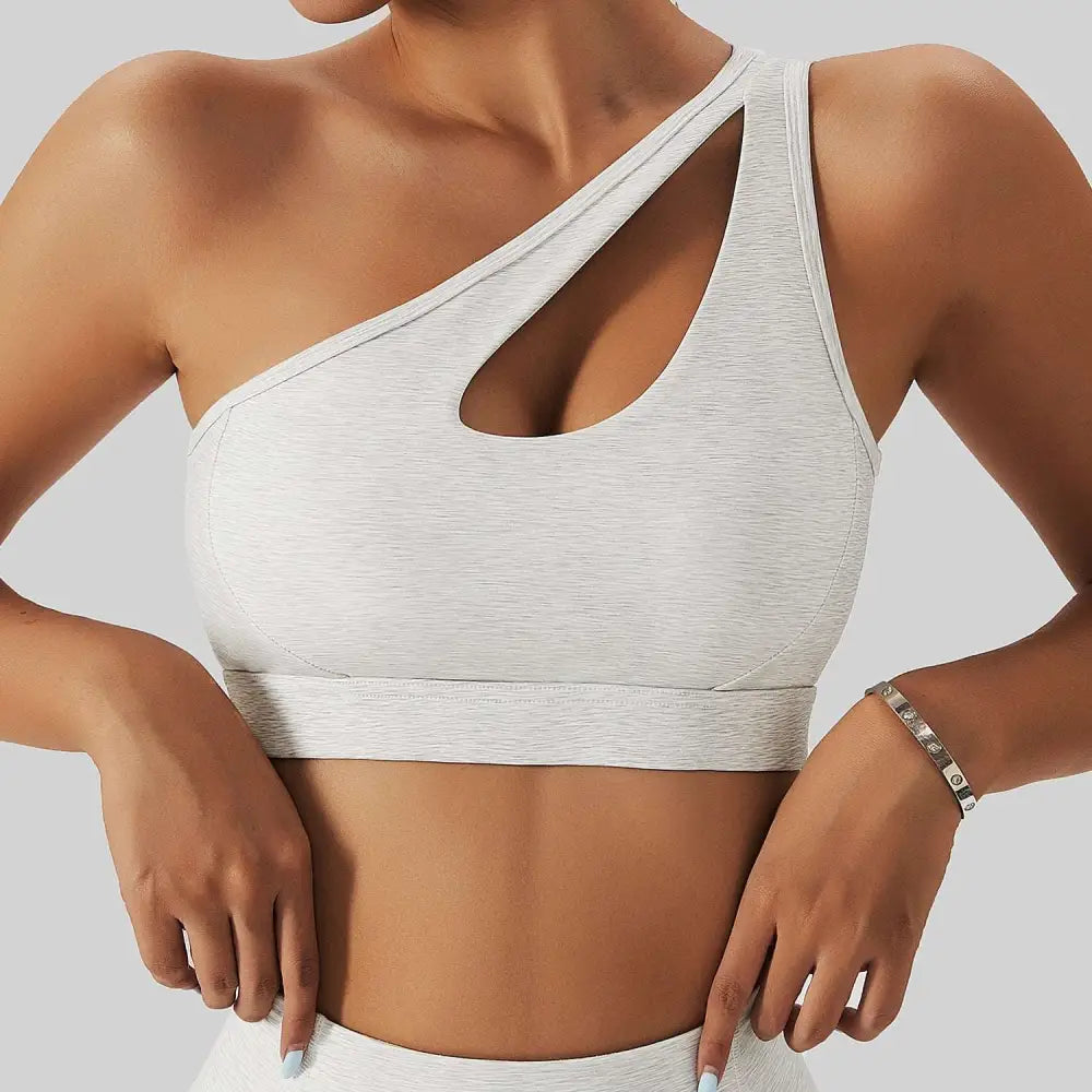 A sleek heathered gray one-shoulder bra fitness suit with cutout design from the olive green yoga collection