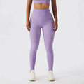 Purple heathered high-waisted leggings with seamless form-fitting design paired with olive green yoga bra fitness suit with pockets