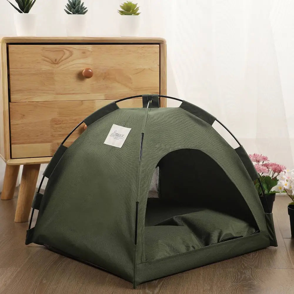 Olive green zippered cat tent with metal frame featuring black trim and a cozy cushion for pet comfort