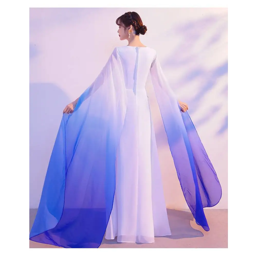 A flowing chiffon ombre cape blue with white to blue gradient drapes over an evening floral choral dress for red song competition