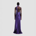 A sleek fitted high waist purple satin rose gown with a one-shoulder design and an open back view