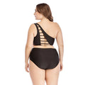 Black one shoulder plus size swimsuit with crisscross back straps and high waist briefs shown from the back side
