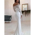 A white mermaid wedding dress featuring lace long sleeve off-the-shoulder design with a sleek satin skirt