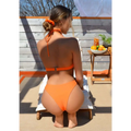 Orange crisscross split bikini set with halter top and high-cut bottoms made from smooth stretchy fabric