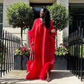 A vibrant red dress luxury robe featuring voluminous orange feathered loose sleeves and hemline for elegant wear