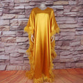 Golden satin dress luxury robe with orange feathered loose trim for elegant and comfortable wear