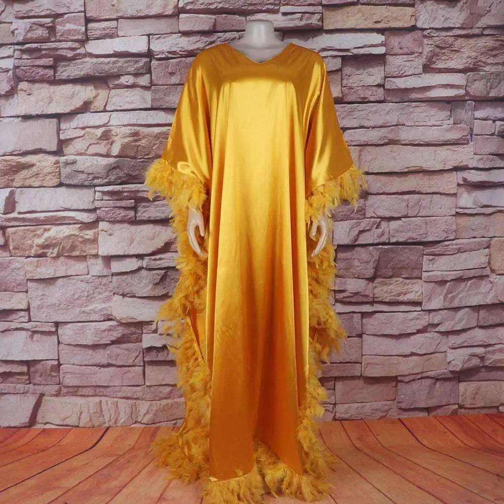 Golden satin dress luxury robe with orange feathered loose trim for elegant and comfortable wear