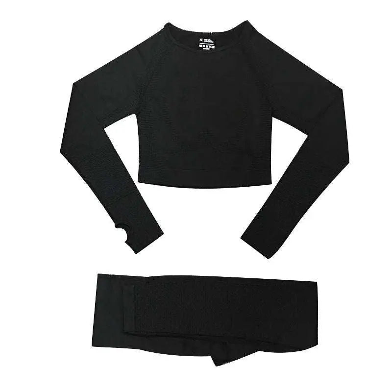 Black long-sleeved crop top with raglan sleeves and wrist cutout paired with matching leggings in orange jacquard seamless yoga set