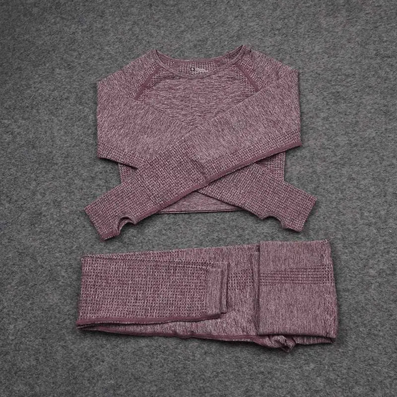 A mauve jacquard seamless yoga two piece set with long-sleeved cropped top and leggings in textured knit fabric