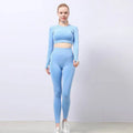 Light blue form-fitting two-piece workout set with textured knit fabric and long sleeves from orange jacquard seamless yoga collection