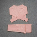 A soft blush pink long-sleeved cropped sweater with textured knit and ribbed cuffs in an orange jacquard seamless yoga set