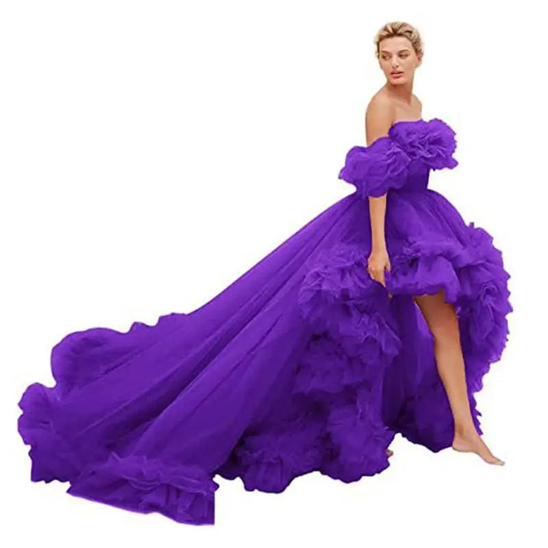 A vibrant purple luxury women’s fashion high low gown with layered ruffles and a flowing train for beaded evening events
