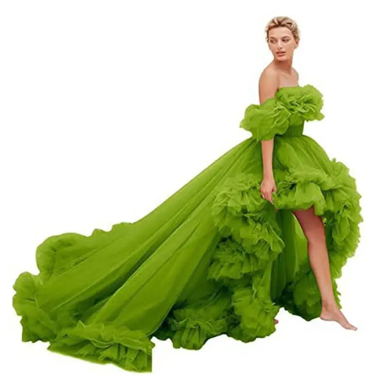 A vibrant lime green luxury women’s fashion high low gown with voluminous ruffled layers and a flowing train