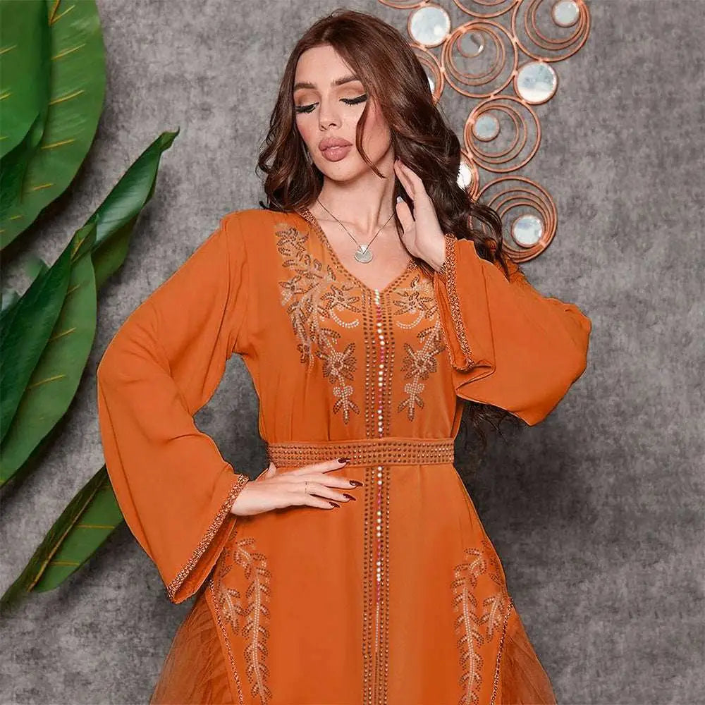 Orange middle east diamond beaded dress featuring a flowing abaya style with intricate gold embroidery and sheer overlay