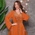 A vibrant orange middle east diamond beaded dress with intricate gold embroidery on front placket cuffs and waistband