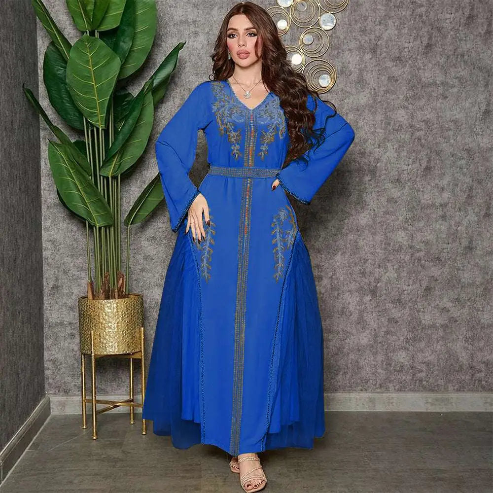 A vibrant royal blue middle east diamond beaded dress featuring intricate gold embroidery on neckline and panels