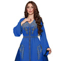 A vibrant royal blue Moroccan-style diamond beaded dress with intricate gold embroidery on neckline and sleeves