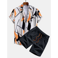 White short-sleeved beach shirt suit with bold orange palm print and matching black shorts with orange drawstring